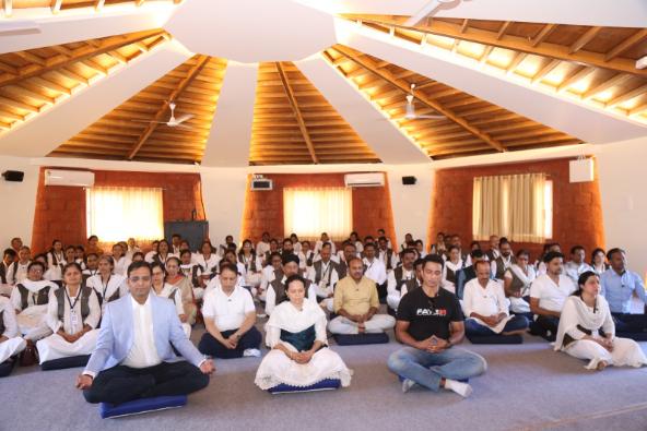 Seekers seated together in a Happy Thoughts hall